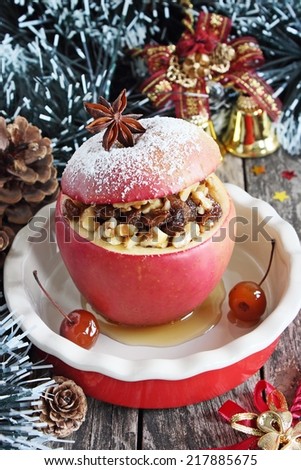 Baked apple stuffed with nuts, raisins and honey.Traditional Christmas dessert.