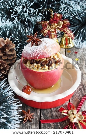 Baked apple stuffed with nuts, raisins and honey.Traditional Christmas dessert.