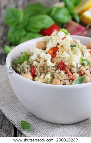 Quinoa salad with vegetables mix, chickpea and cheese.