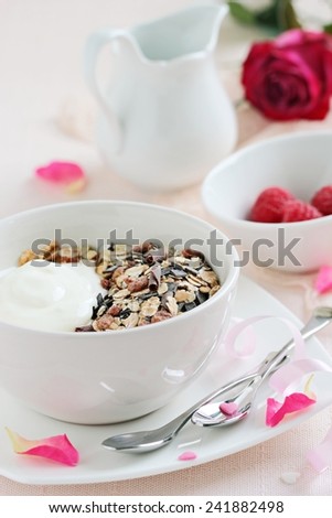 Whole grain muesli  with chocolate chips,yogurt and fresh raspberries.Healthy breakfast on Valentine\'s Day .