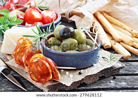 Antipasto appetizer on a wooden table.Selective focus.