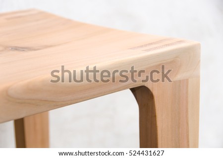 Detail of a wooden glued joint of a chairs leg. Material used for the stool  is cherry wood untreated with a sanded finish