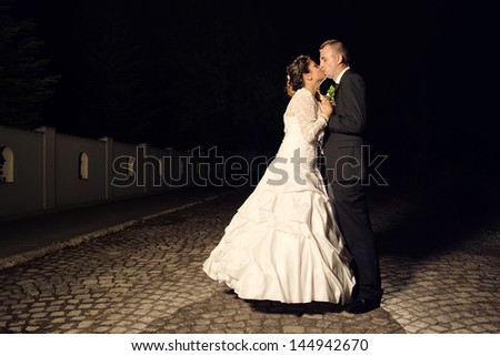 Bride and groom after wedding day, night