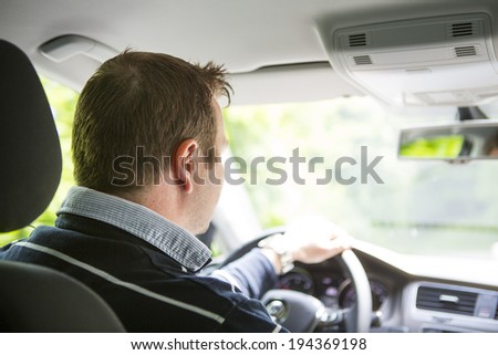 Driver in-car. Image taken from the backseat.