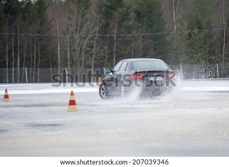 NOKIA, FINLAND - NOVEMBER 2, 2014: The Audi Quattro Tour 2014 test drive day in Nokia, Finland. Professional drivers were teaching how to drive safely in winter conditions on November 2, 2014.