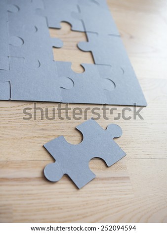 A puzzle missing one piece.