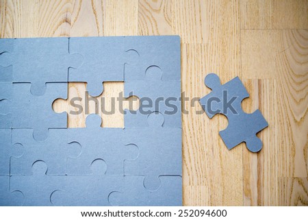 A puzzle missing one piece.