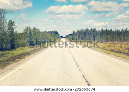 Life is a journey as they say. This image describes it completely showing just an empty road in the summer time. Image has a vintage effect.