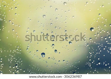 Water droplets in the window glass. This image is suitable for example for text backgrounds, website backgrounds, or anything else. Image has a vintage effect.