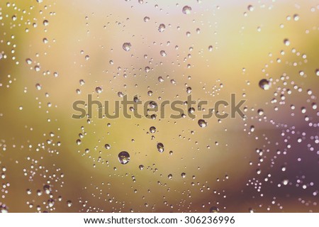 Water droplets in the window glass. This image is suitable for example for text backgrounds, website backgrounds, or anything else. Image has a vintage effect.
