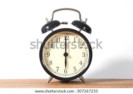 It\'s six o\'clock already. Time to wake up and hurry. An image of a retro clock showing 06:00 am or pm.