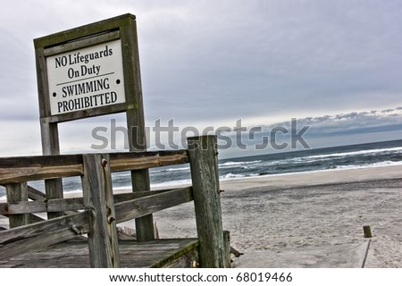 Sign for no Lifeguards on duty and swimming prohibited during winter on beach on Long Island, New York