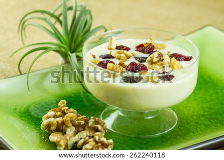 Smoothie with dried cherries and crushed walnuts on top