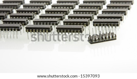 Microchips ordered like army unit with one upside-down (closeup)