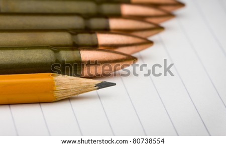 Row of cartridges and pencil - power written word concept