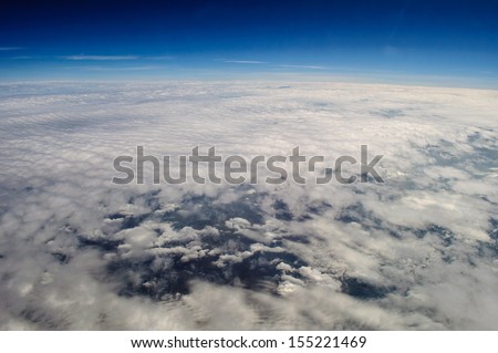Sky clouds, ocean blue, view from the airplane window