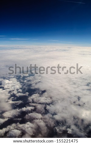 Sky clouds, ocean blue, view from the airplane window