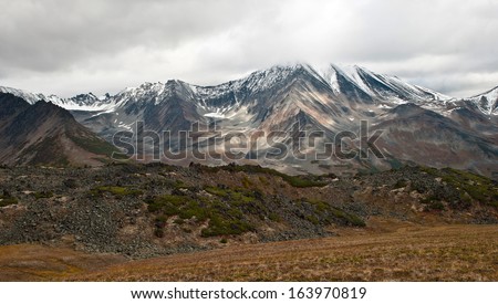Mountainous landscape in the autumn in bad weather. Kamchatka