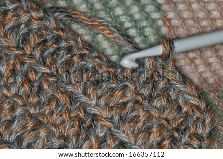 knitting yarn and hook on the rug