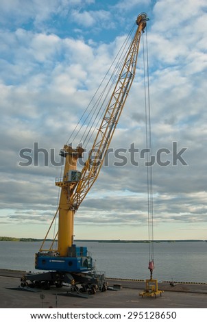 crane at the port on the Gulf coast in the background of the sky