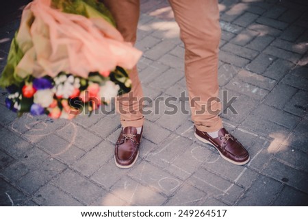 Valentine\'s Day. Man holding bouquet of flowers. Proposal scene