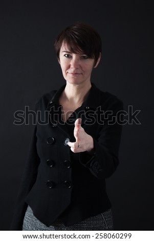 Beautiful woman doing different expressions in different sets of clothes: gun sign