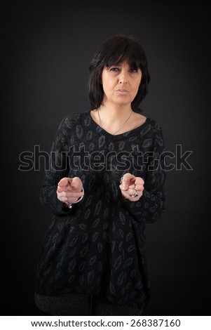 beautiful woman doing different expressions in different sets of clothes: gun sign