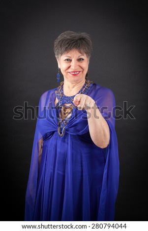 Beautiful woman doing different expressions in different sets of clothes: pointing