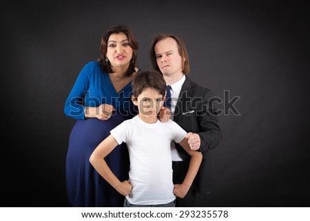 Beautiful family doing different expressions in different sets of clothes: angry