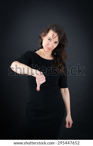 Beautiful woman doing different expressions in different sets of clothes: thumbs down