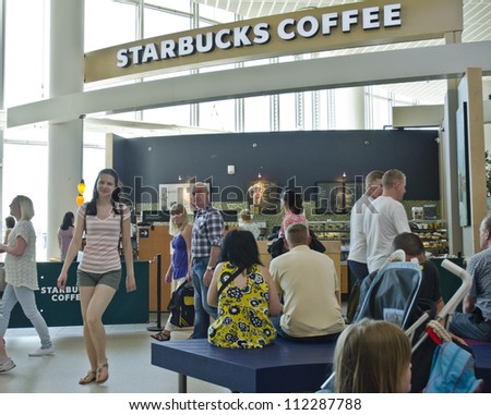 MANCHESTER, ENGLAND - MAY 26: a Starbucks Coffee outlet on May 26, 2012 in Manchester, England. On September 6, Starbucks announced a $78m investment to enter the Indian market.