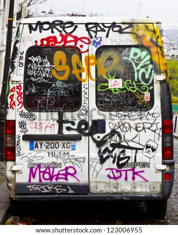 PARIS - NOVEMBER 19: graffiti on a van on November 19, 2012 in Paris, France. Graffiti vandalism costs $25 billion per year in the USA alone. This graffiti is in Paris, France.