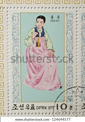 NORTH KOREA - CIRCA 1977: a stamp from North Korea shows image of a woman in traditional North Korean costume, circa 1977