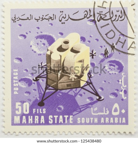 MAHRA SULTANATE - CIRCA 1969: a stamp from Mahra Sultanate (present day Burkina Faso) shows image commemorating a moon landing, circa 1969