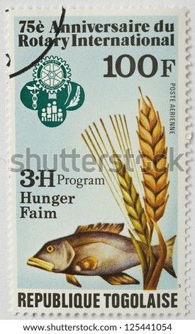 TOGO - CIRCA 1980: a stamp from Togo shows image of a fish and commemorates the food security work of Rotary International, circa 1980