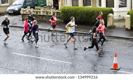 EDINBURGH - APRIL 14: runners take part in the Rock \'n\' Roll Edinburgh Half Marathon on April 14, 2013 in Edinburgh, Scotland. 2013 is the 2nd year the event has taken place in Edinburgh.