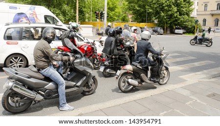 ROME - JUNE 5: riders of scooters and motorbikes on June 5, 2013 in Rome, Italy. Rome is the most dangerous city in Europe for traffic accidents 28,000 injuries per annum.