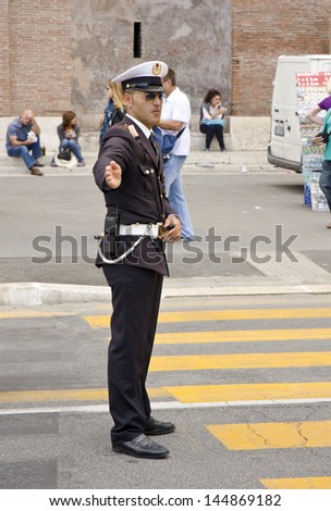 ROME - JUNE 5: a traffic police officer on June 5, 2013 in Rome, Italy. Traffic police in Rome are traditionally male but the first female officer started in 2009.