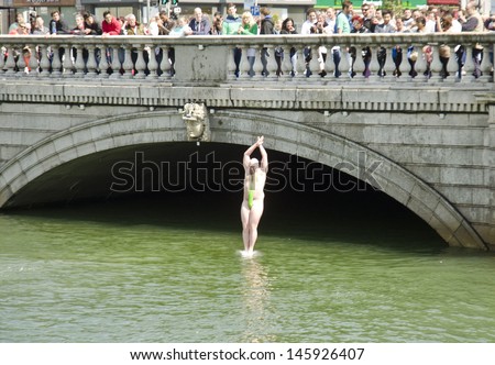 DUBLIN, IRELAND - MAY 25: as part of the Liffey Fun Swim in aid of cystic fibrosis sufferers, a man in a mankini jumps into the River Liffey on May 25, 2013 in Dublin, Ireland.