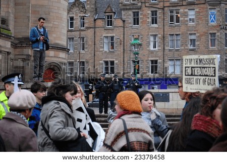 EDINBURGH - JANUARY 15: Police (in the background) record the student protest against the Israeli attacks in Gaza January 15th, 2009 at The University of Edinburgh in Edinburgh, Scotland.