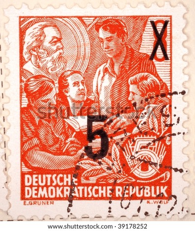 EAST GERMANY - CIRCA 1951: A stamp printed in East Germany shows image of men with books, series, circa 1951