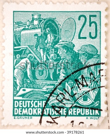 EAST GERMANY - CIRCA 1951: A stamp printed in East Germany shows image of a train at a station, series, circa 1951