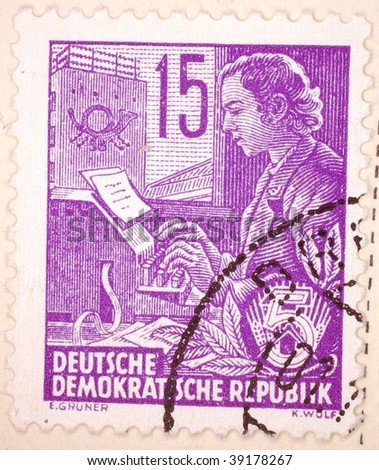 EAST GERMANY - CIRCA 1951: A stamp printed in East Germany shows image of a typist, series, circa 1951