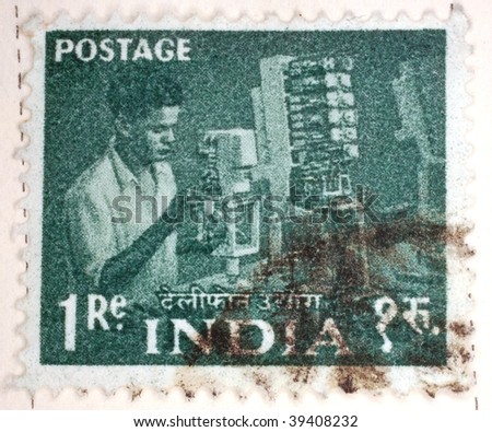 INDIA - CIRCA 1954: A stamp printed in India shows image of a man working in a factory, series, circa 1954