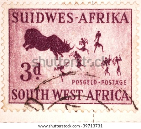 SOUTH WEST AFRICA - CIRCA 1949: A stamp printed in South West Africa, now Namibia, shows image of a bull and tribes-people, series, circa 1949