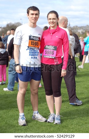 EDINBURGH - MAY 2: A couple get ready to run in the Great Edinburgh Run 10 km event on May 2nd, 2010 in Edinburgh, UK.