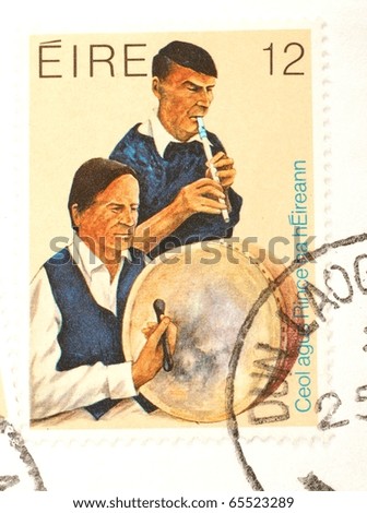 IRELAND - DATE UNKNOWN: a stamp printed in Ireland shows image of two musicians playing the drums, circa unknown