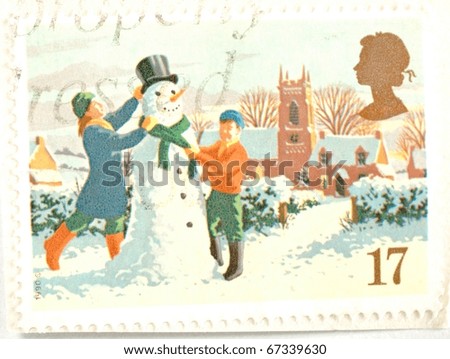 UNITED KINGDOM - CIRCA 1990: a stamp printed in the United Kingdom shows image of children making a snowman, circa 1990