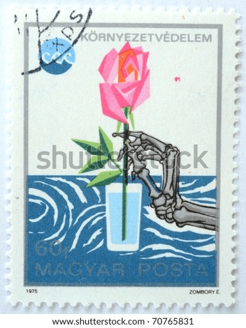 HUNGARY - CIRCA 1975: a stamp from Hungary shows image of a skeleton touching a rose in a glass, circa 1975