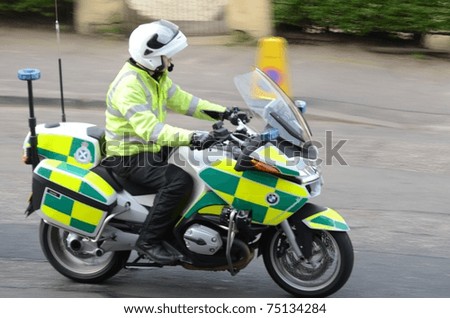 EDINBURGH - APRIL 10: A police motorcycle in the ADT Edinburgh Half Marathon on April 10, 2011 in Edinburgh, Scotland. Organizers admitted the course was 300 meters too long following complaints